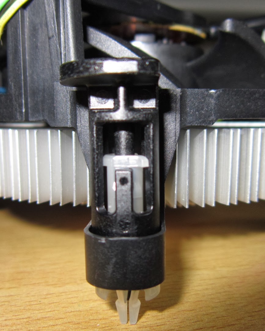 Close-up image of an Intel heatsink showing the push pin that holds the heatsink in place in a motherboard.